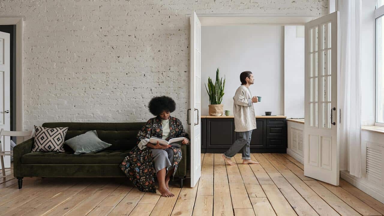 A couple doing their own thing at home