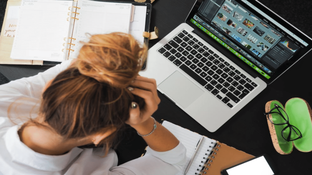 A woman looking stressed at work