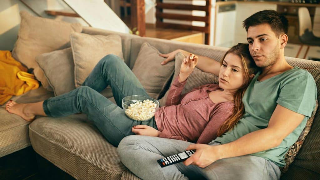 A couple relaxing on a couch