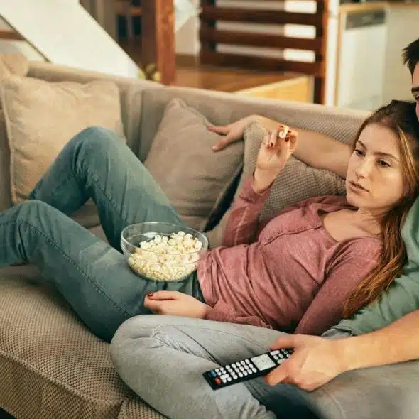 A couple relaxing on a couch