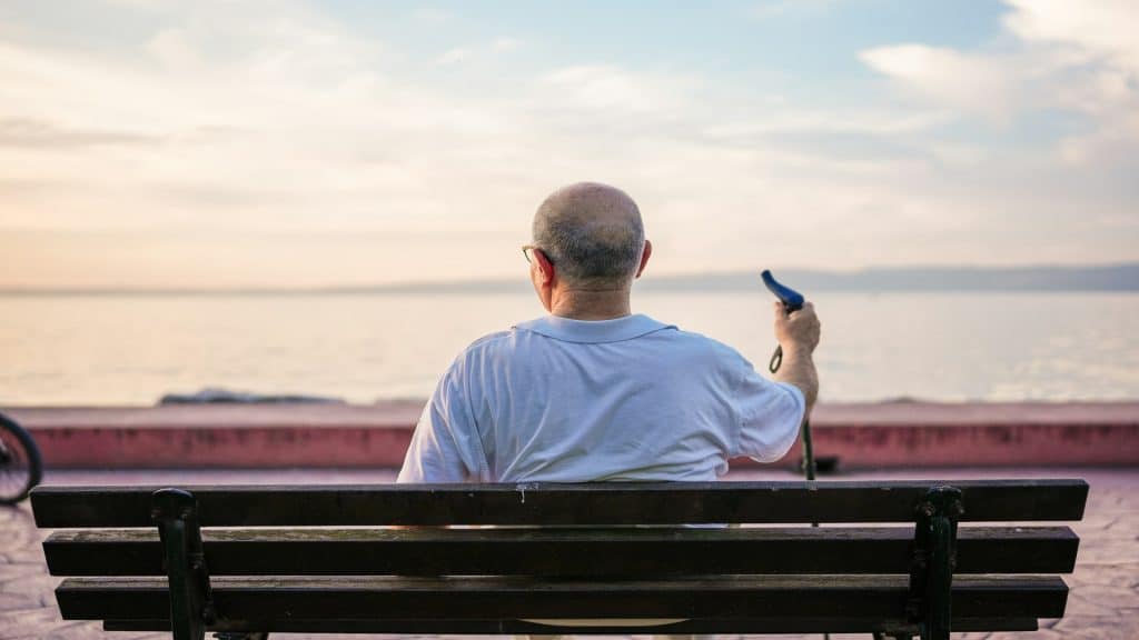 man sitting on bench outdoors