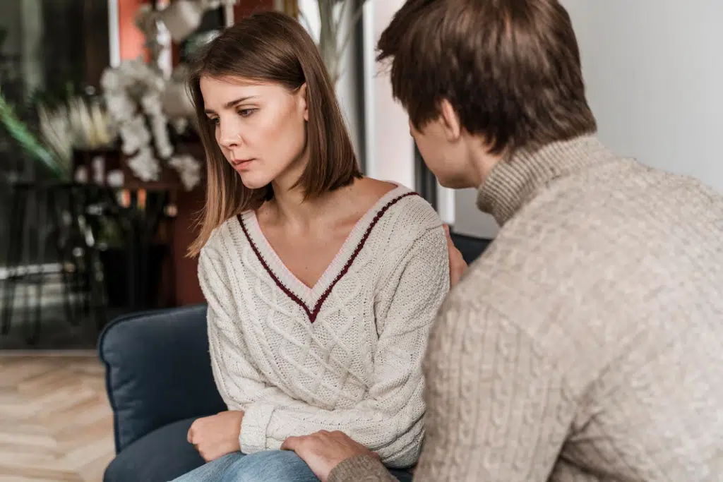 Sad woman avoiding conversation with husband