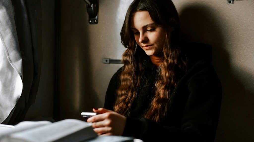 A person sitting by a window