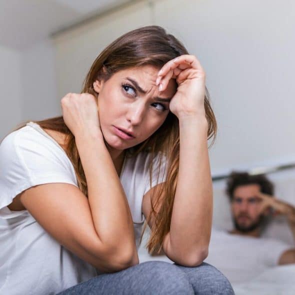 A couple lost in thoughts after a quarrel.