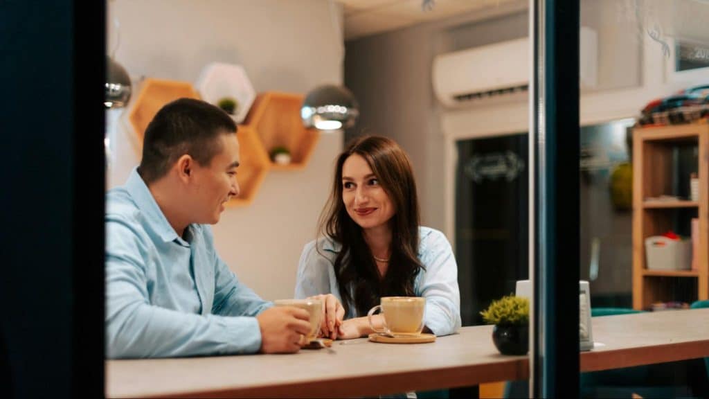Woman smiling to a man