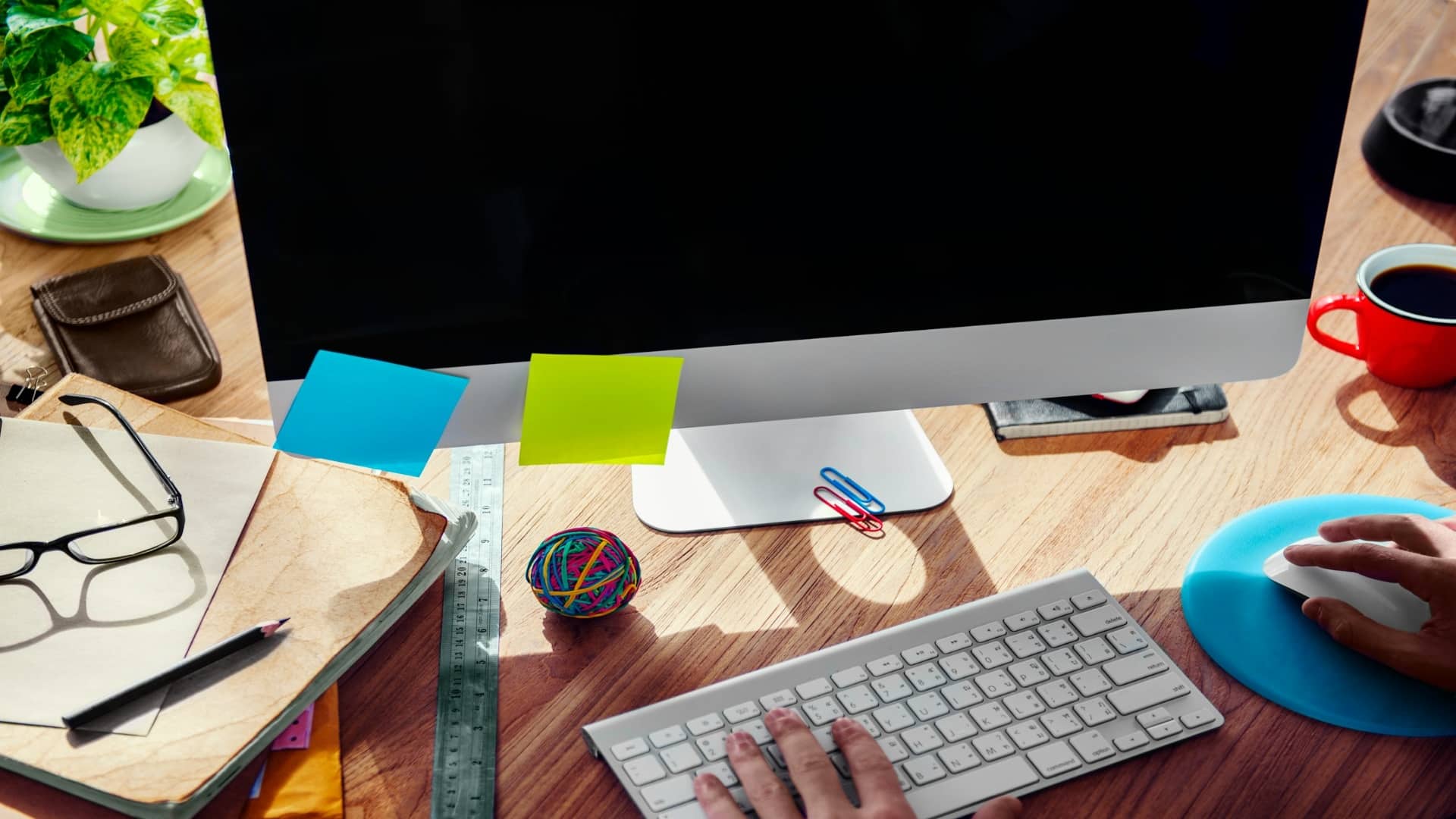 man organizing work at desk