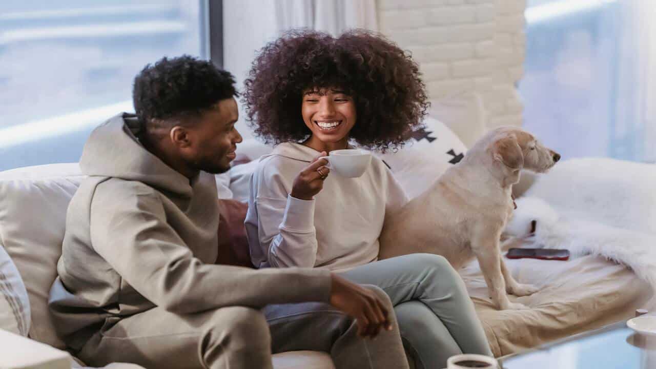 A couple talking on the sofa