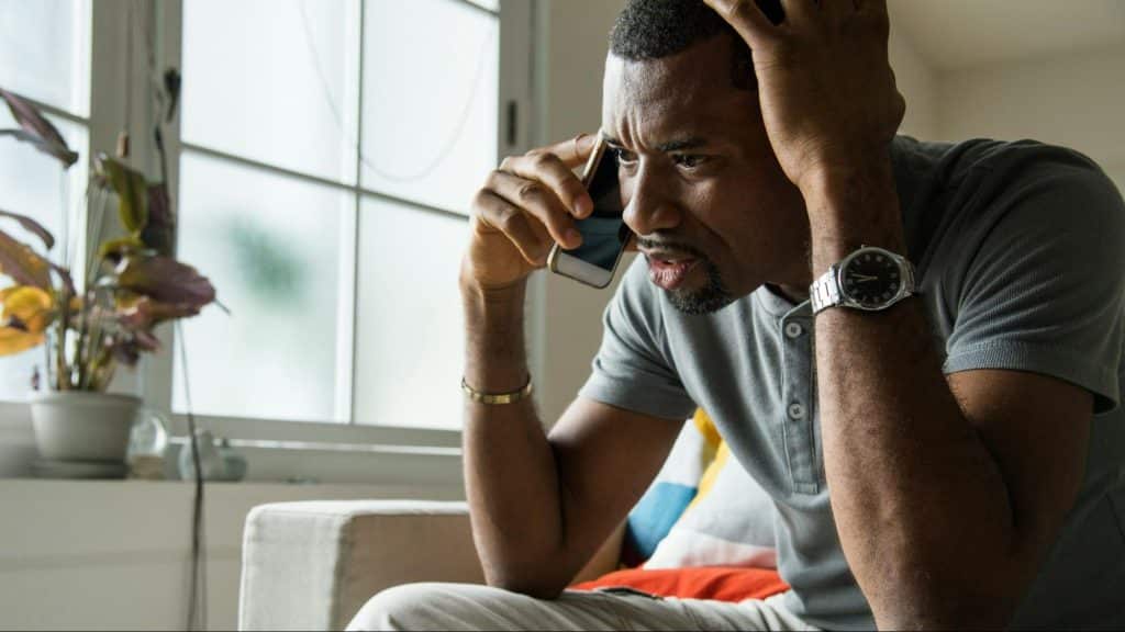 A man talking through the phone