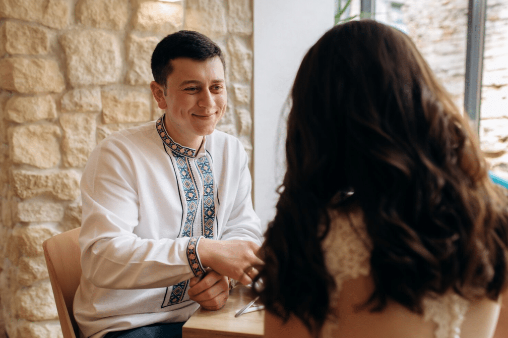 A man giving support to woman