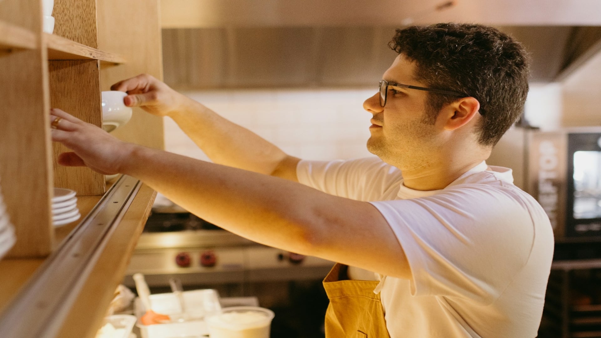 man helping partner with household task