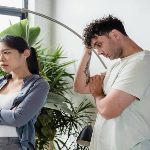 A woman looking annoyed by her husband