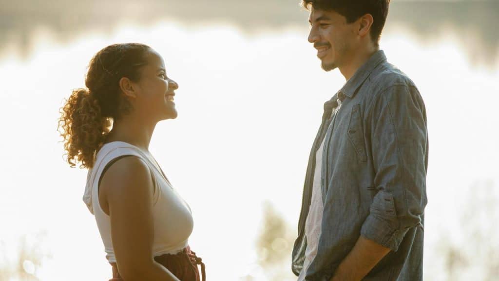 A smiling couple facing each other