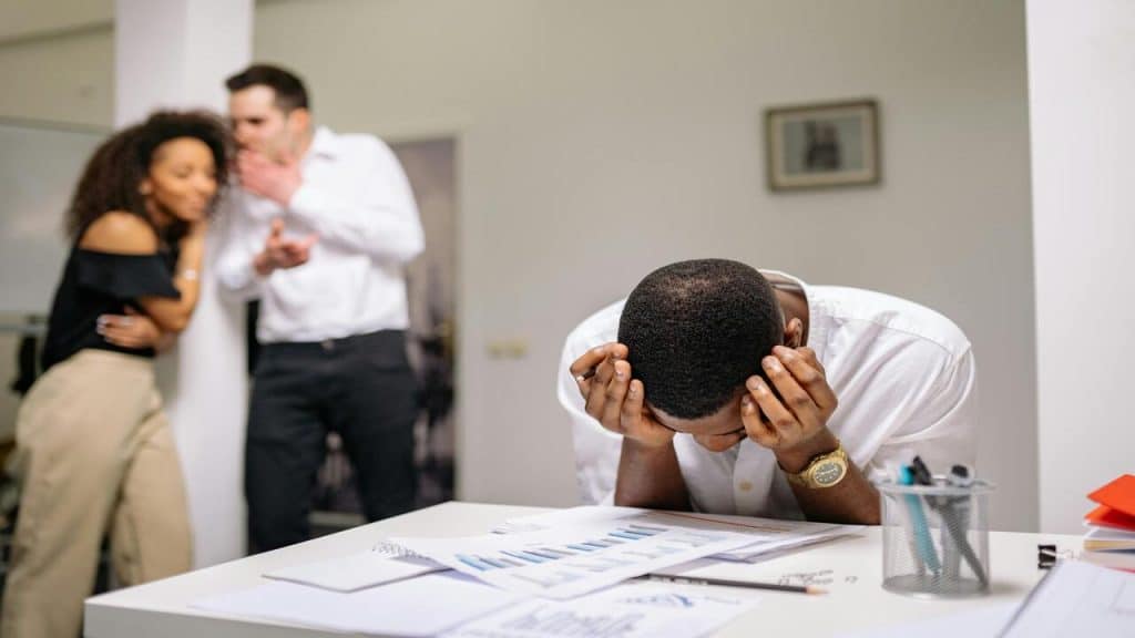 A man ignoring office drama