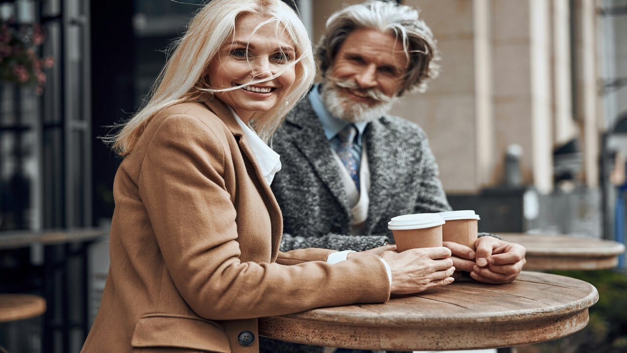 A mature couple having coffee together
