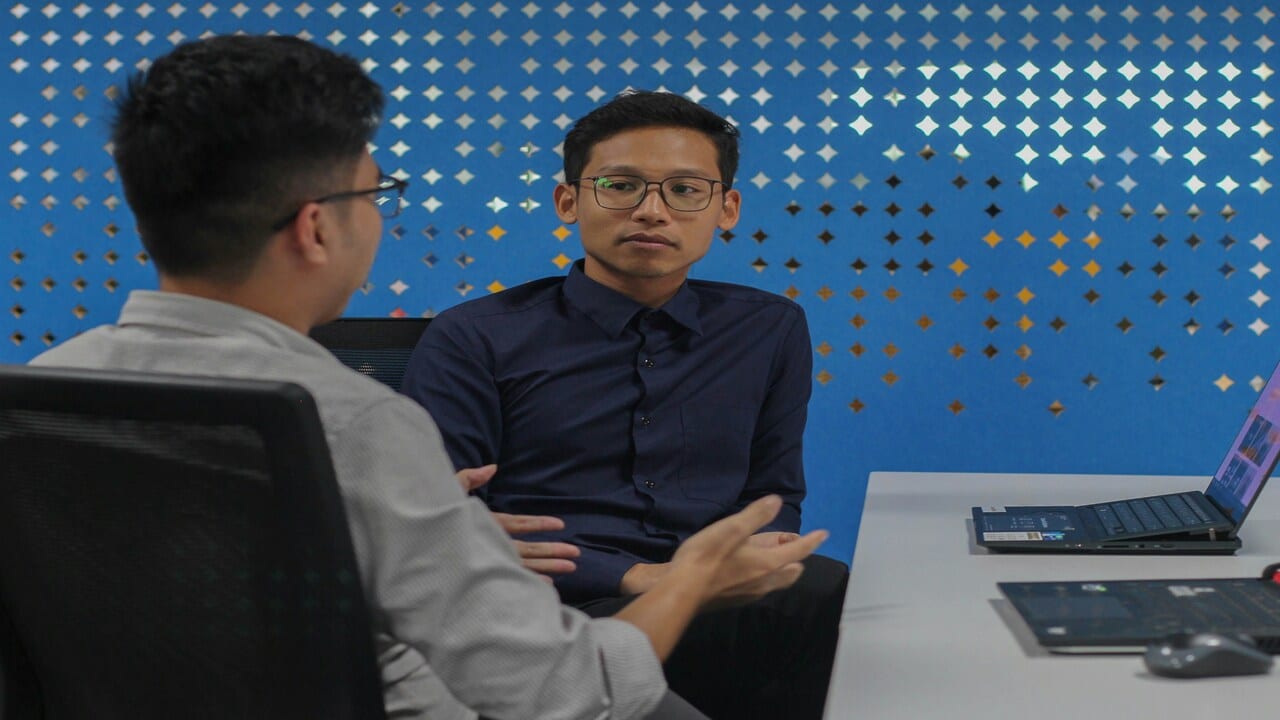 Colleagues talking at work