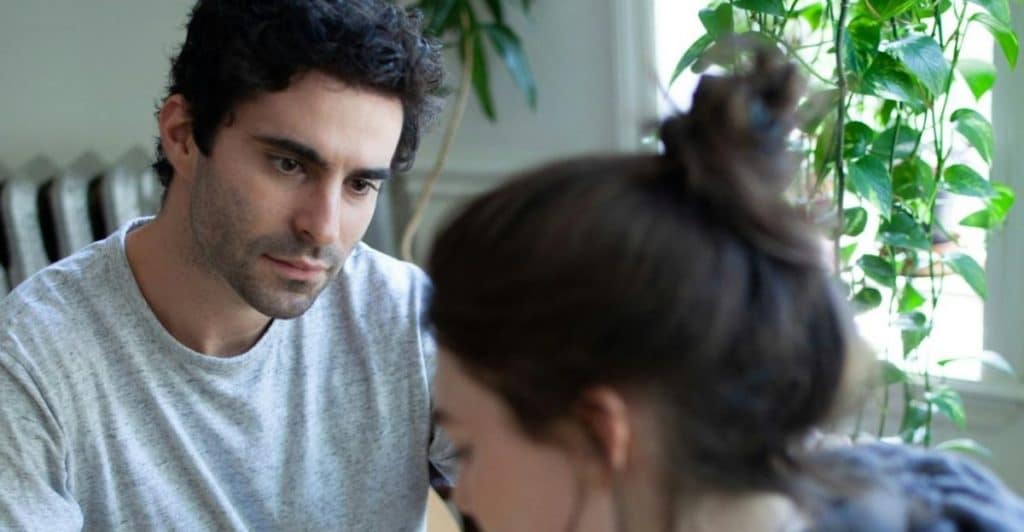 A man staring at the woman