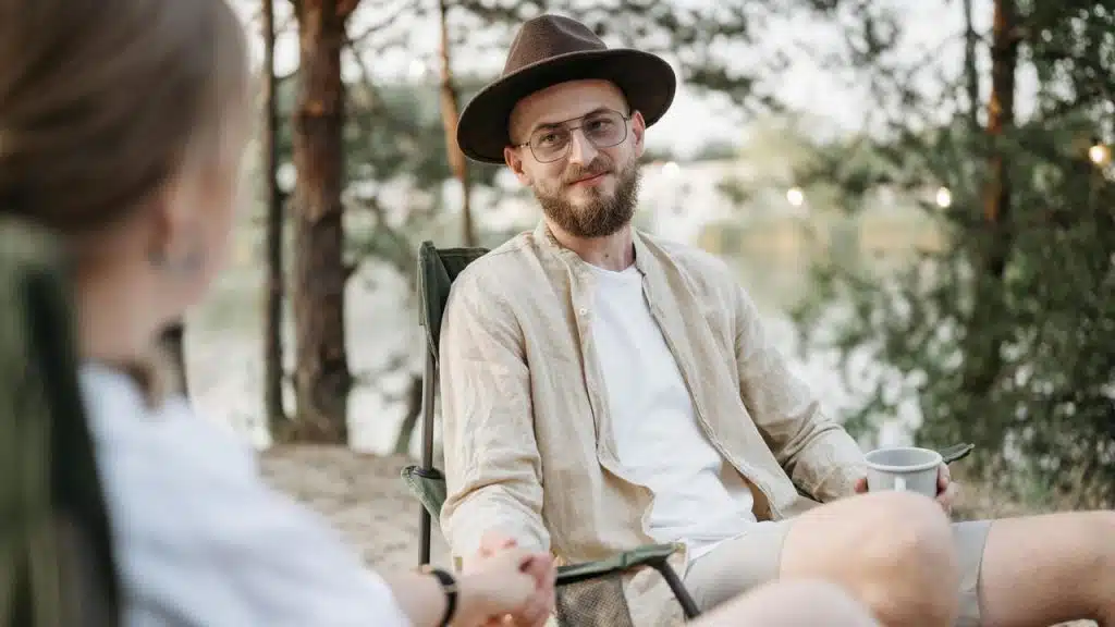 A man wearing a hat and glasses