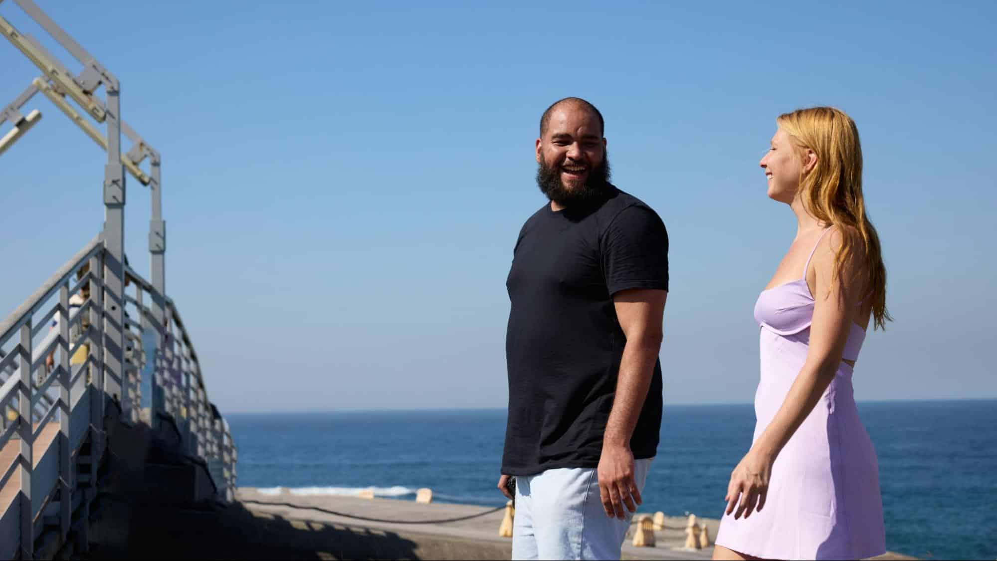 A man and woman looking at each other