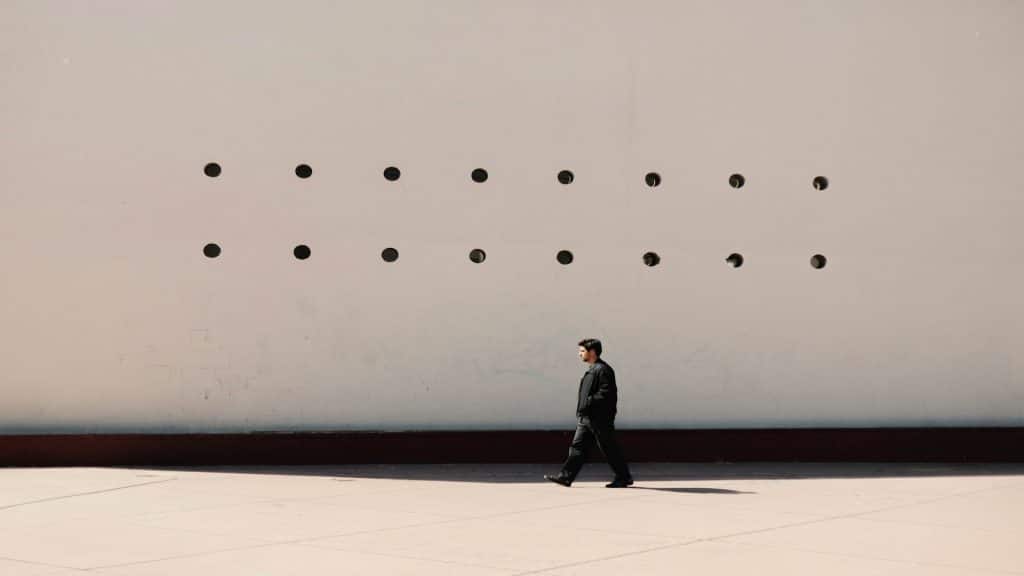 man walking alone outdoors