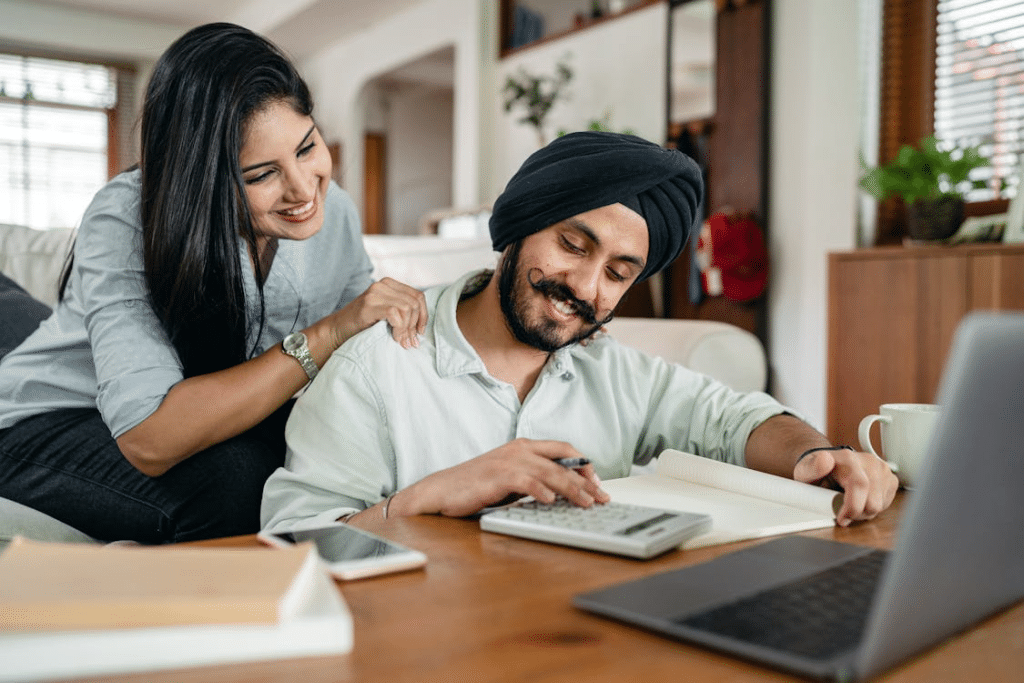 Happy Couple Looking at Paperwork