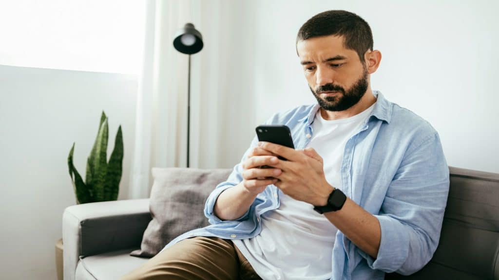 man looking at phone