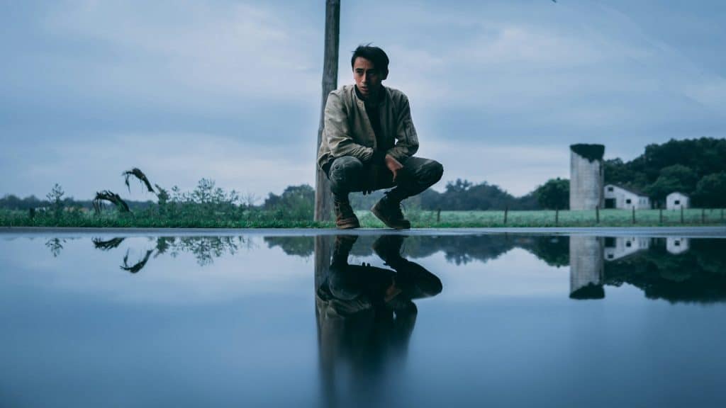 man sitting alone reflecting