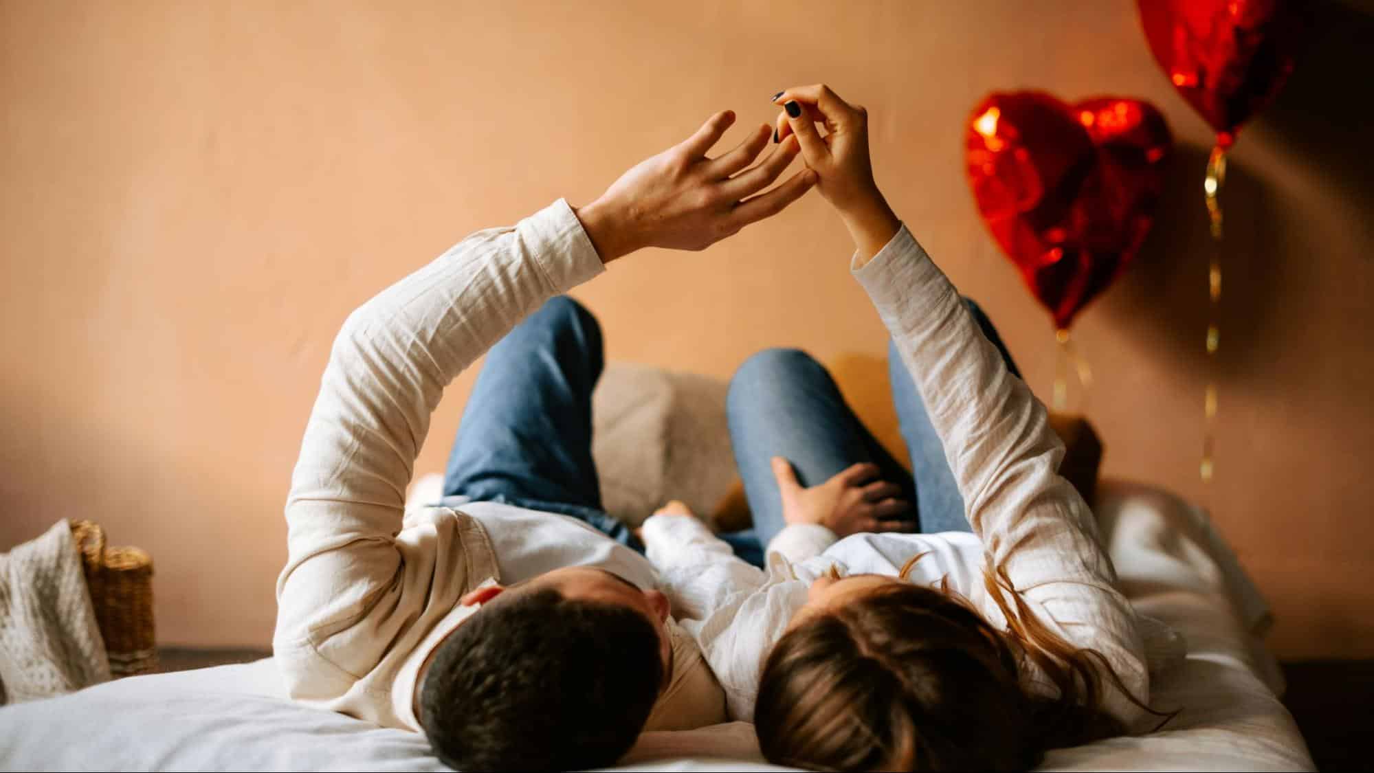 A man and woman touching hands