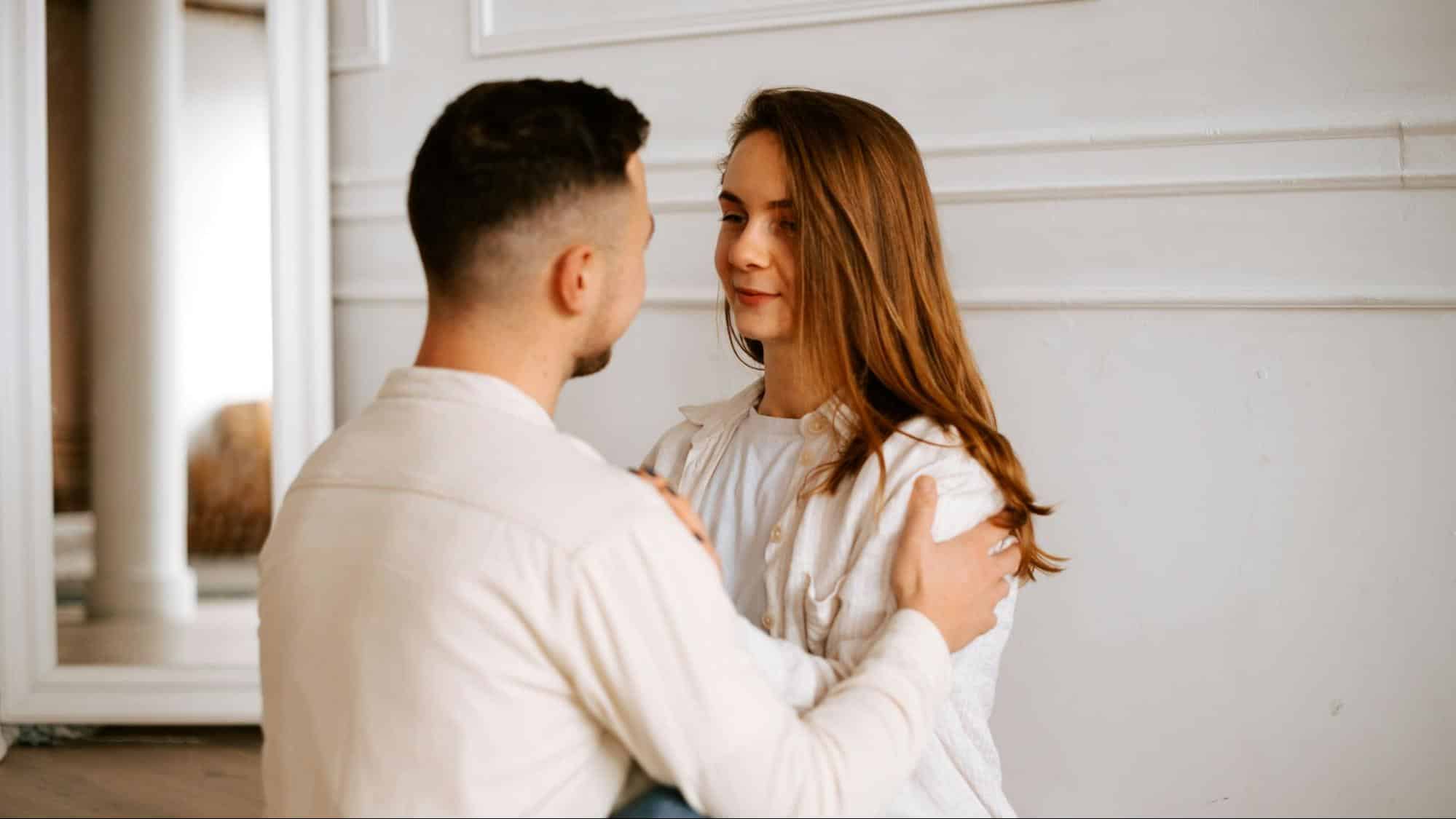 A man and a woman facing each other