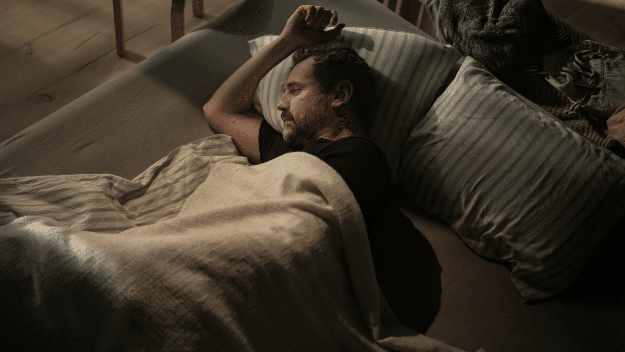 A man laying in bed