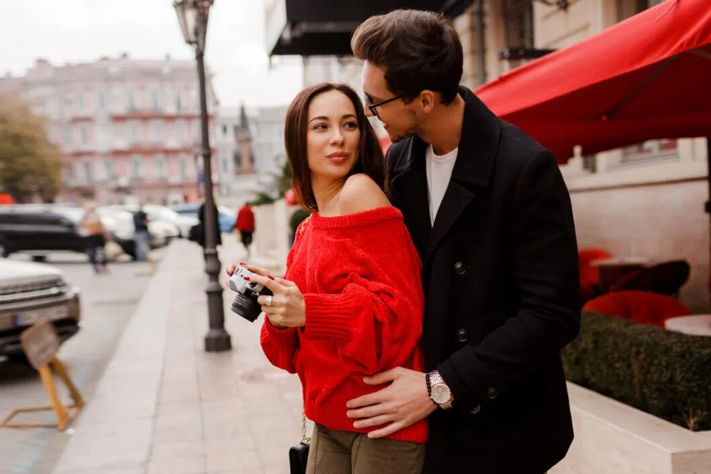 Woman and man flirting in the street