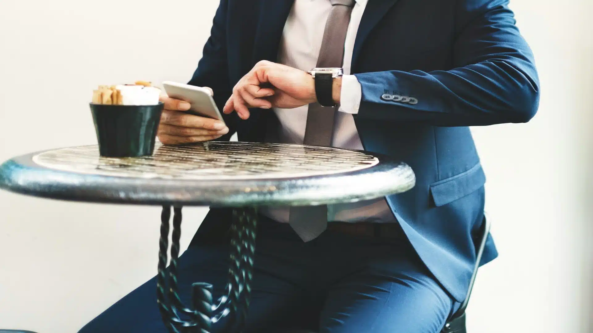 man checking schedule on phone