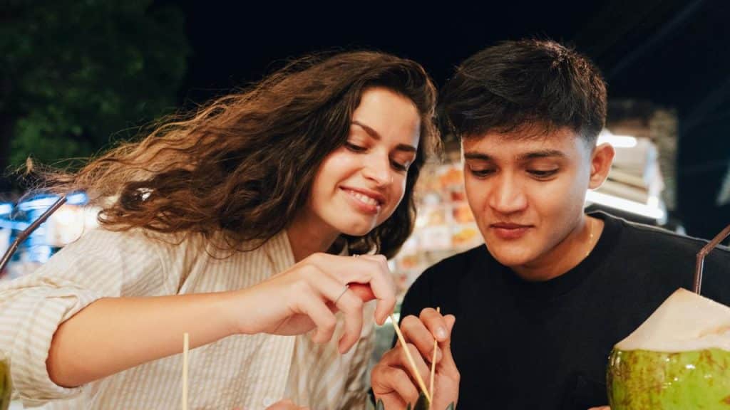 A couple enjoying street food