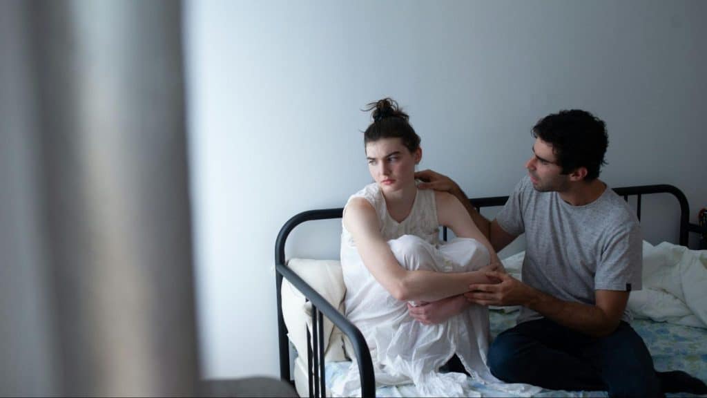 A man trying to speak with woman