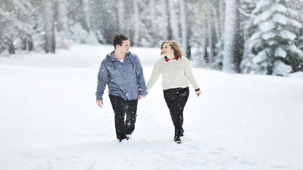 couple holding hands outdoors