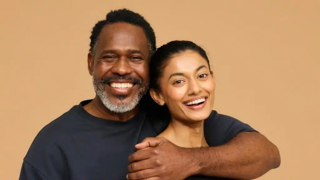 A man and a woman hugging each other.
