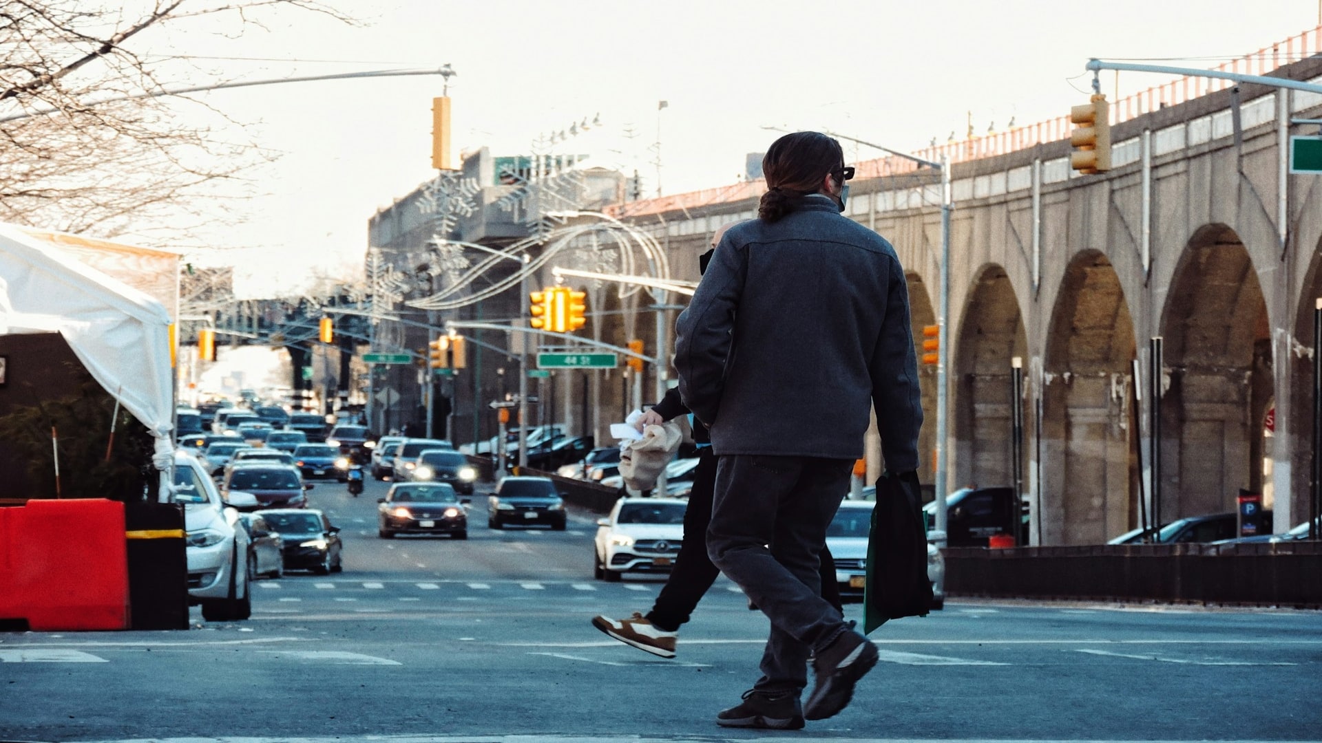 man walking confidently in city