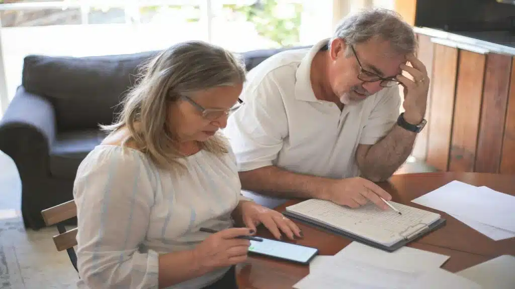 A mature couple working on their bills