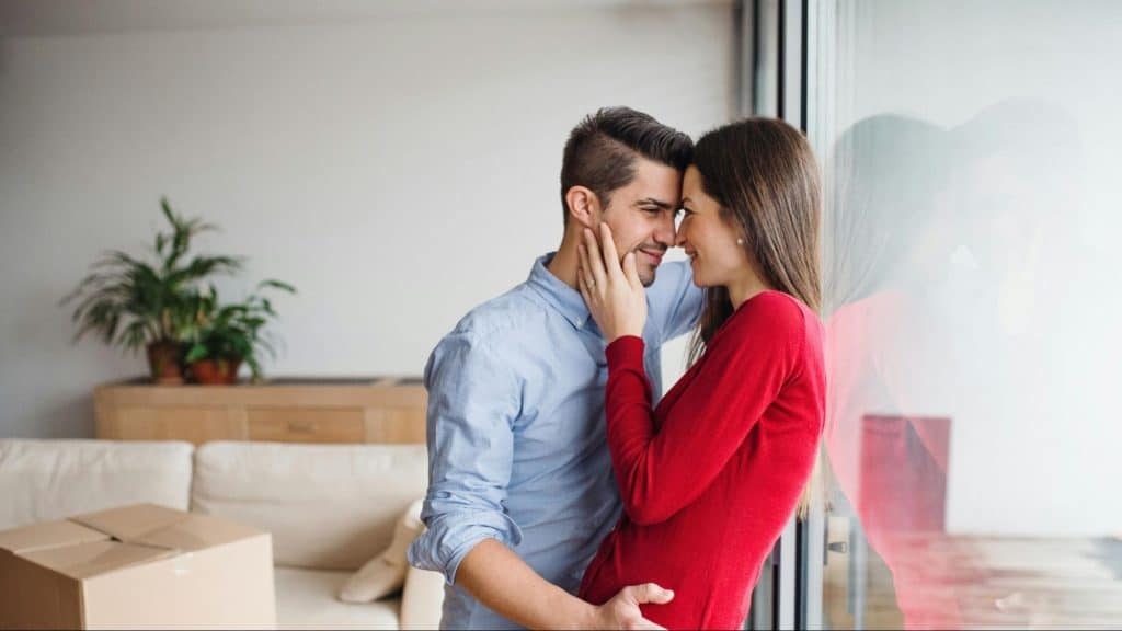 A man and woman smiling and close to each other