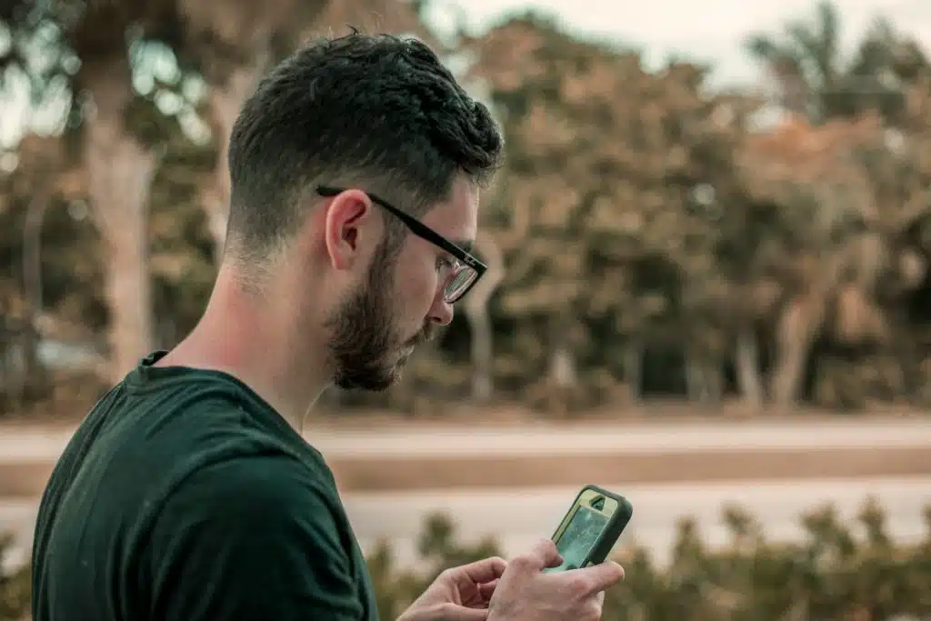 man texting phone