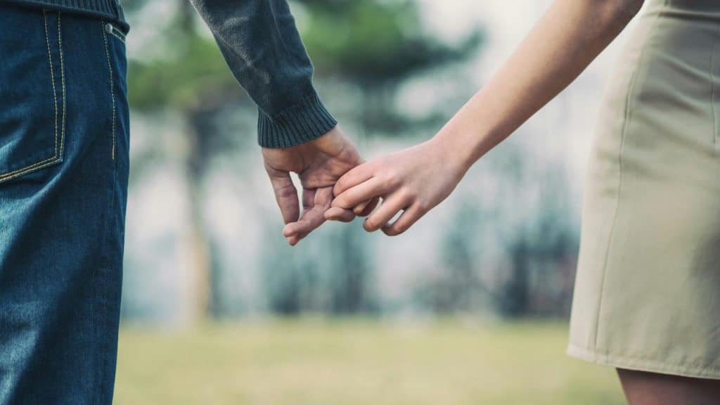 A couple holding hands