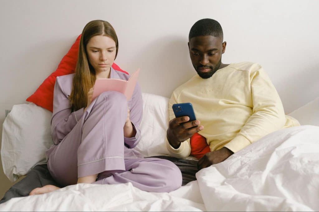 A man and woman busy with their hobbies