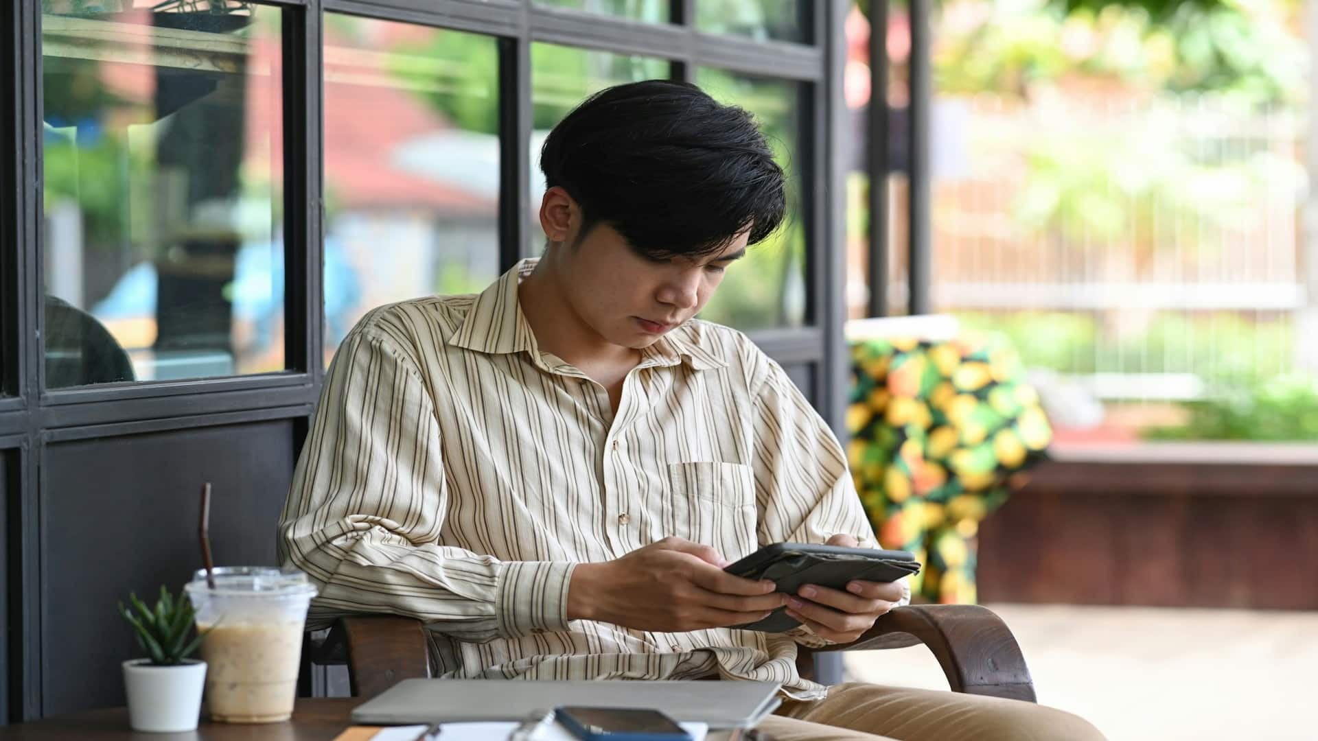 man checking phone during busy day