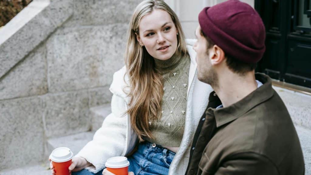 A woman and man talking