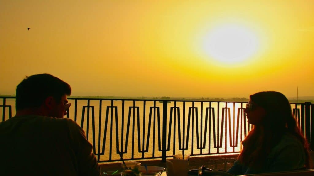couple watching sunset from balcony