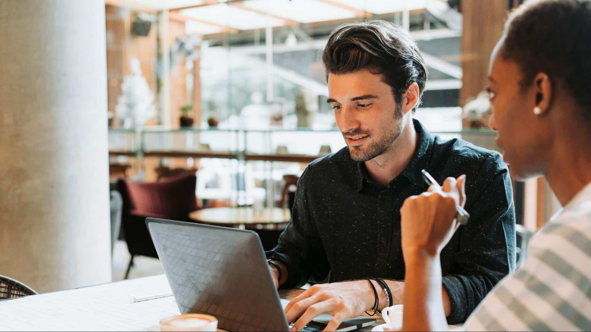 A man talking with woman in his work