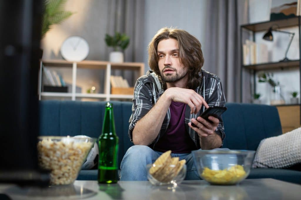 man sitting alone couch