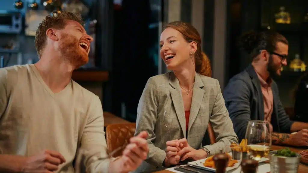 A man and woman laughing together 