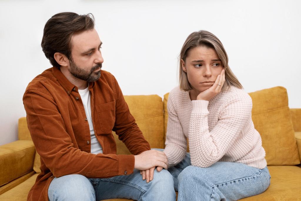 A man trying to speak with a woman