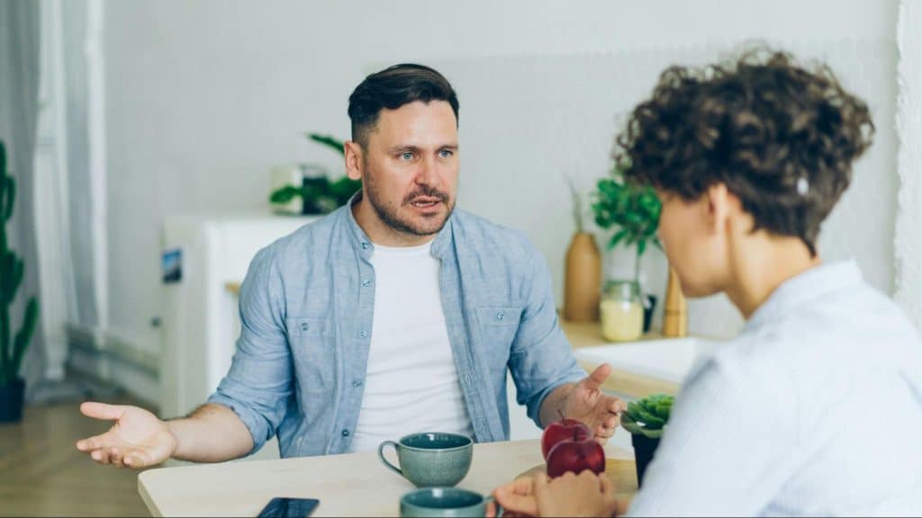 A man questioning a woman