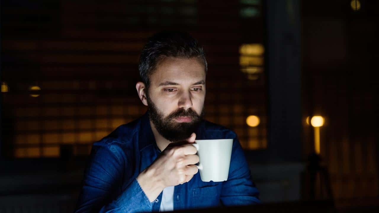 A man holding a mug